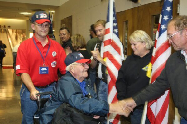 shaking retired veteran's hand