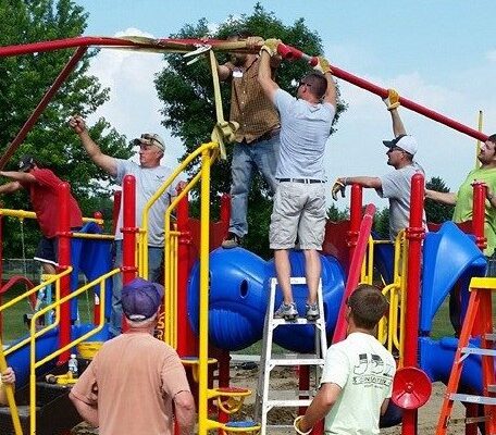men building a playground set