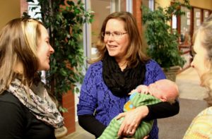 Community Philanthropy Director Liz Cheney (left) and her husband Matt just welcomed a little boy, Zachary, into our SWIF family.  Jackie Turner-Lovsness, Nancy Fasching and other staff enjoyed his first office visit this week. 