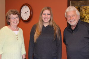 Hutchinson High School senior Maddie Hoel, center, has been job shadowing with SWIF staff members Berny Berger, and Greg Jodzio to learn how they work with business startups and business loans.