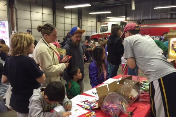 Parents and children gathered at the Mountain Lake fire station for a family event.