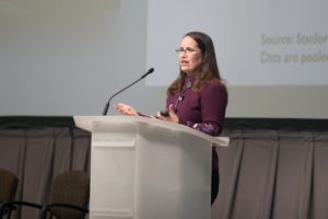 Beth Mattingly speaking at a podium
