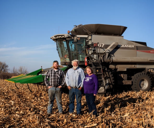 Zac Walton and Geof and Leann Johnson by their combine