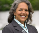 Formal headshot of board member Teresa Peterson