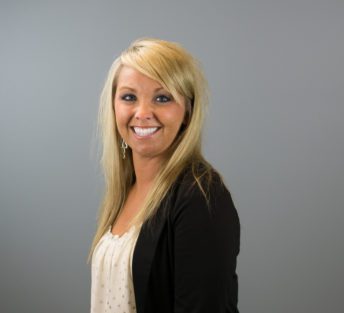 headshot of Missy in front of a grey background