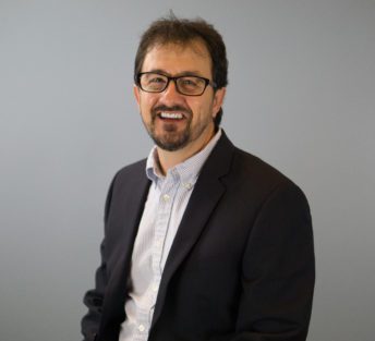 headshot of Jeff in front of a grey background