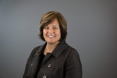 headshot of Amy in front of grey background