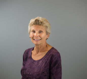 headshot of Marsha in front of a grey background