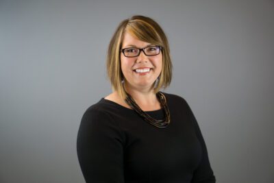 headshot of Karen in front of a grey background