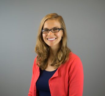 headshot of Marie in front of grey background