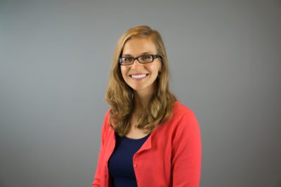 headshot of Marie in front of grey background