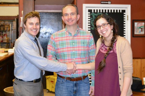 Bluenose Gopher Public House board members Andrew and Sarina shake hands with SWIF Vice President Scott Marquardt