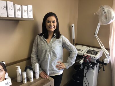 Luci Lopez stands near a display of skin care products inside Zenglo Beauty day spa.
