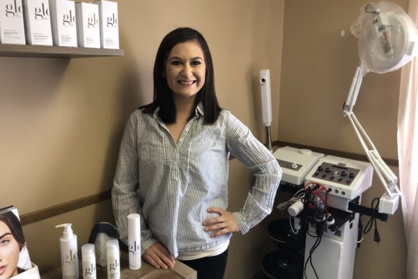 Luci Lopez stands near a display of skin care products inside Zenglo Beauty day spa.