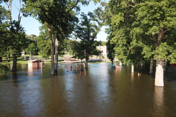 Playground equipment in Jackson's Ashley Park is partially submerged as the Des Moines River overflows its banks.