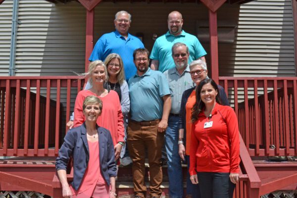 Pipestone Area Community Foundation advisory members stand outside on a stairway