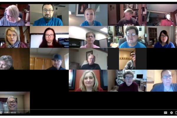 Screen shot of a video meeting with a grid of people