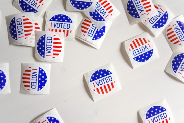 Red, white and blue circle stickers with I VOTED text