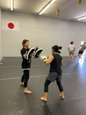 Olivia in a training session at the martial arts studio