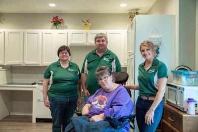 Joan, Jeremy, Melissa and JoAnn pose for a photo together in the accessible kitchen.