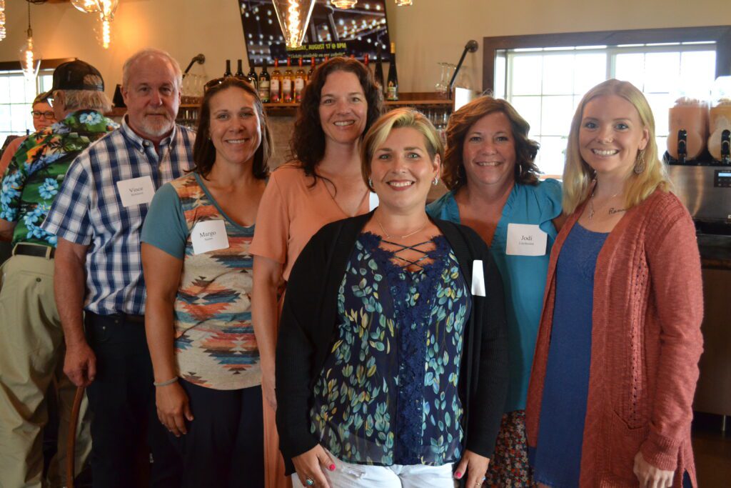 Members of the Lake Benton Area Foundation Board pose together for a group photo at Painted Prairie Vineyard.