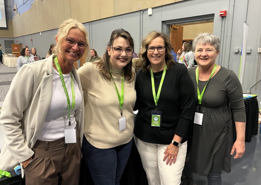 A small group poses at the Kids First Conference.