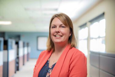 Johanna poses for a formal head shot inside the foundation office.