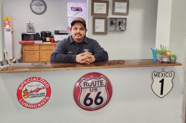 Jose Lopez stands behind the counter at El Chilero Auto Repair.