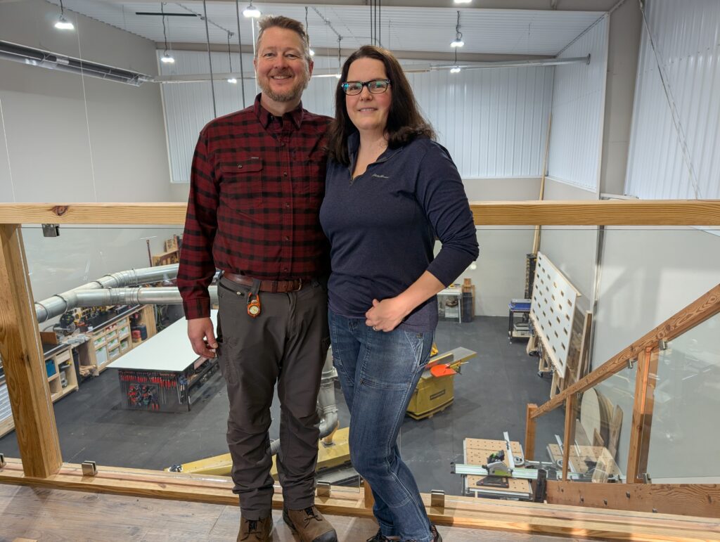Kevin and Anne Veldhuisen
stand inside the shop for Woodgrain Custom Builds.