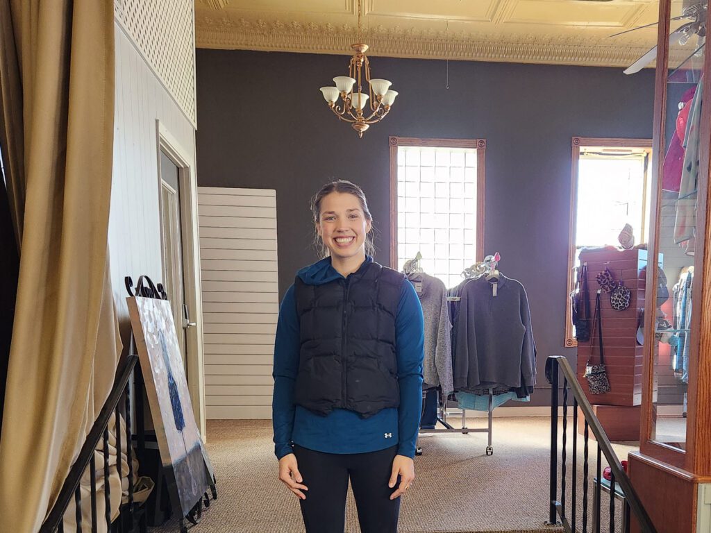 Autumn stands inside her New London consignment store, Closet Collective.