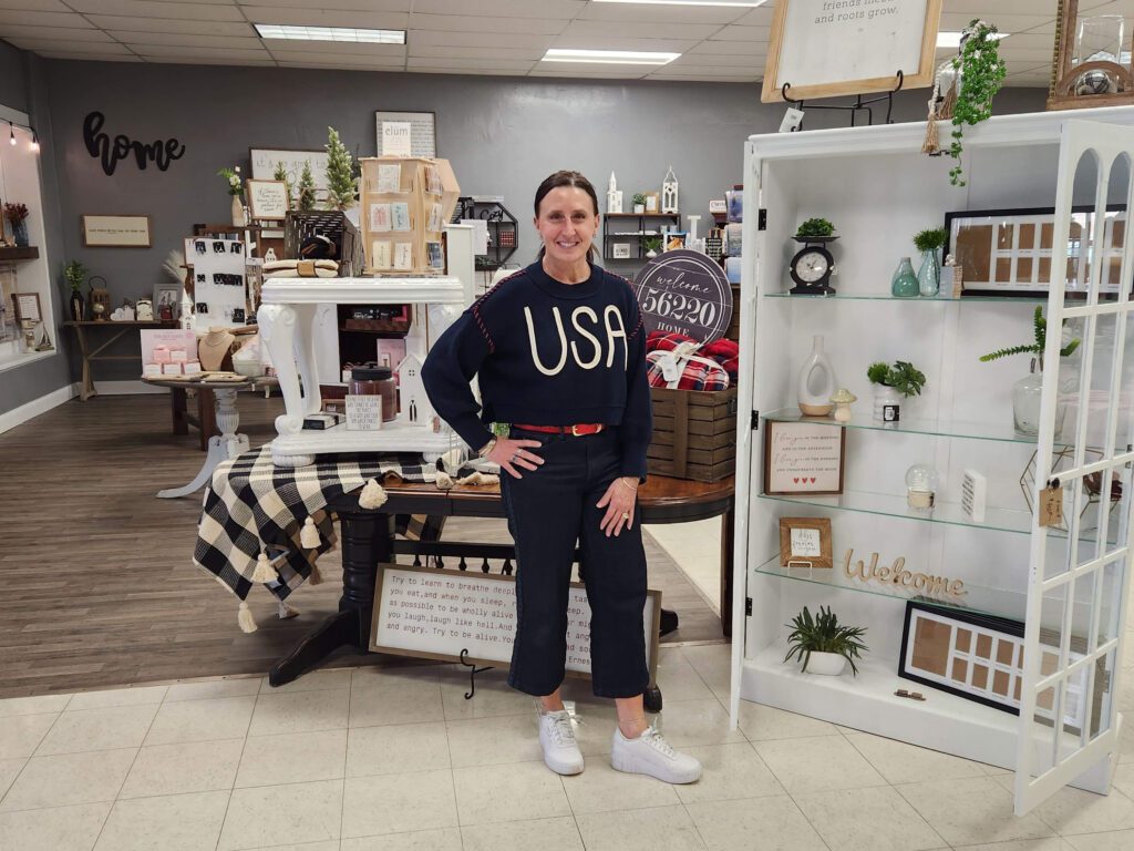 Lori stands inside her boutique, The Gift II, in Canby.