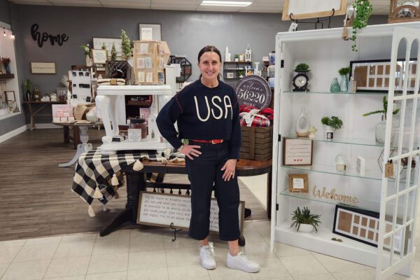 Lori stands inside her boutique, The Gift II, in Canby.