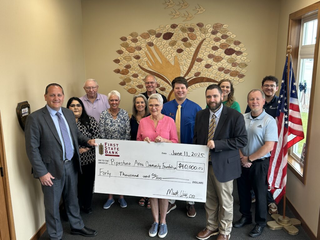 A large group photo with a giant check for a Member Impact Fund grant to the Pipestone Area Community Foundation
from First State Bank Southwest.
