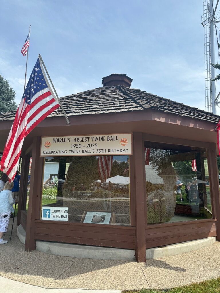 Twine Ball Gazebo with flags and 75th anniversary banner