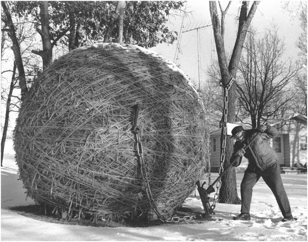 To keep the Twine Ball round, Francis rotated the massive creation with a railroad jack. He also chained it to a tree so no one would steal it, showing his sense of humor as the ball weighs several tons.
