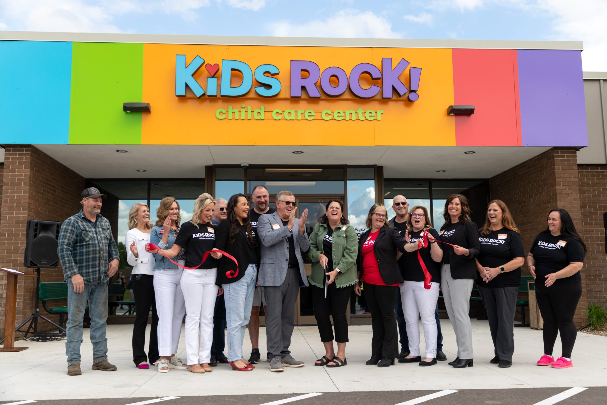 On May 28, a red ribbon snapped in half between giant scissors as a large group of supporters cheered in Luverne, celebrating the opening of Kids Rock! Child Care Center.