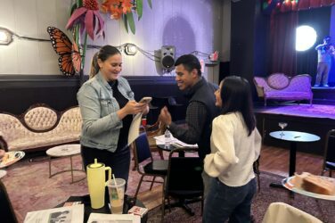 Growing Local: Emerging Leaders graduates mingle at Little Theatre Auditorium.