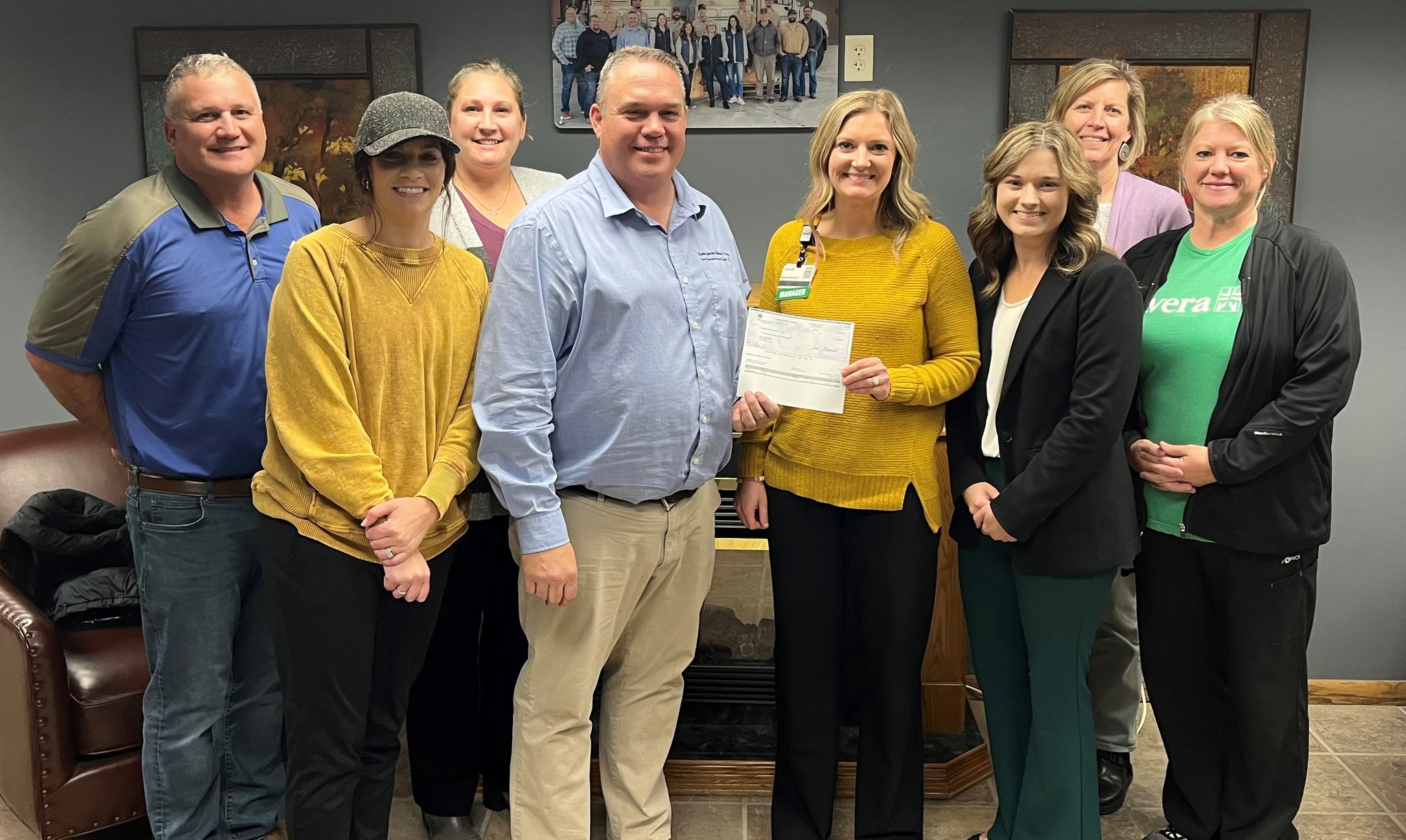A group of board members and staff pose with the Tyler ARea Community Foundation grant award for Avera Tyler.