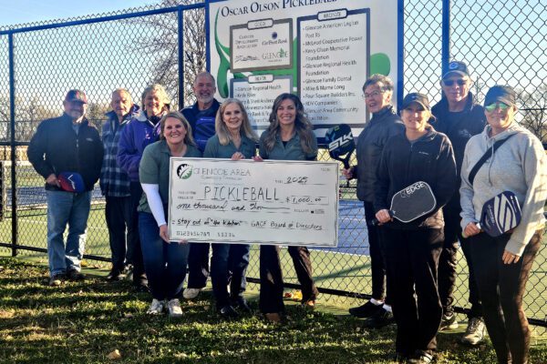 Glencoe Area Community Foundation Advisory Board Members present a check for the new pickleball courts.