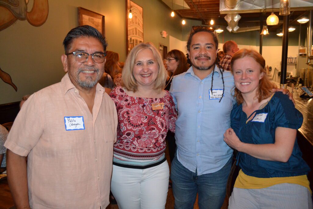 Nancy poses for a group photo at our Hope is Brewing social hour in Willmar.