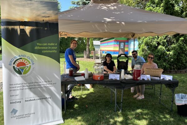 Bird Island-Olivia Community Foundation advisory board members represent the foundation at the Renville County Artisan and Farmers Market in Bird Island.