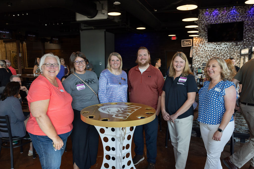 SWIF staff mingle at a Summer Social event.